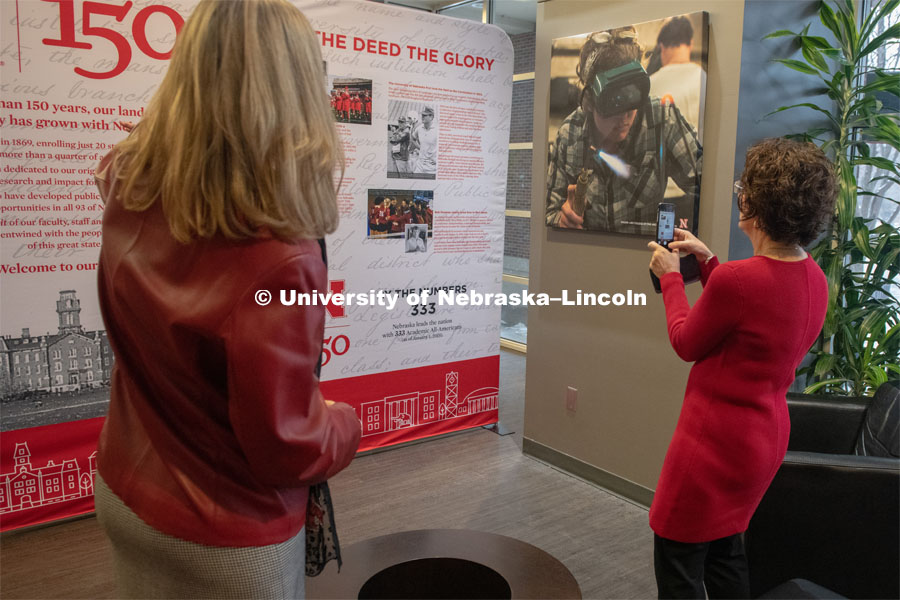 Diane Mendenhall and Michelle Waite, part of the Chancellor's Executive Team, look over the traveling history exhibit in the Student Union. February 11th, 2019. Photo by Gregory Nathan / University Communication.