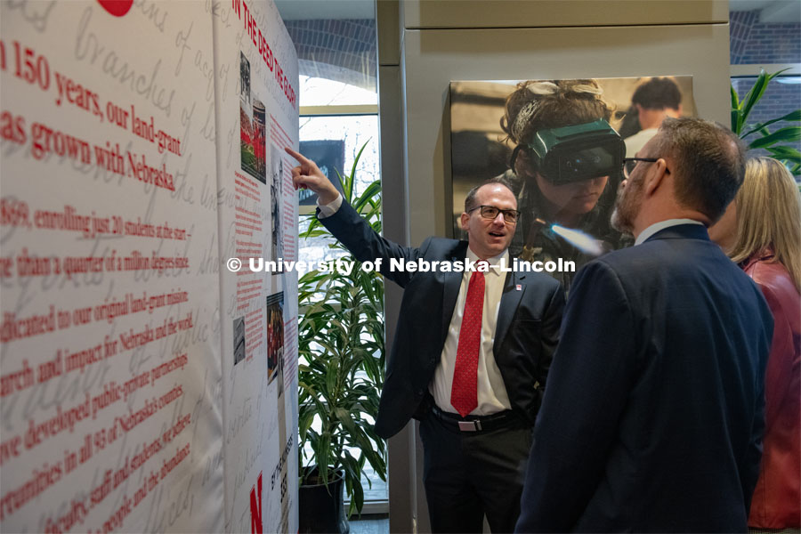 William Nunez and Diane Mendenhall look over the traveling history exhibit in the Student Union with Chancellor Ronnie Green. February 11th, 2019. Photo by Gregory Nathan / University Communication.