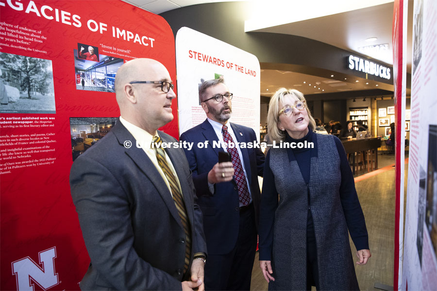 Michael Boehm, Vice Chancellor of Institute of Agriculture and Natural Resources, left, Chancellor Ronnie Green, center, and Executive Vice Chancellor Donde Plowman look over the traveling history exhibit in Nebraska Union. February 11, 2019. Photo by Craig Chandler / University Communication.