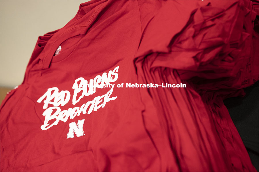 A stack of shirts for the student section. The Huskers men’s basketball game helped celebrate the university's 150th birthday with a halftime birthday party. The Huskers played against Minnesota. February 13, 2019.  Photo by Craig Chandler / University Communication.