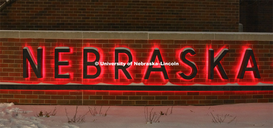 A University of Nebraska sign glows red as part of the Glow Big Red. Glow Big Red bathes the campuses with red lights as part of N150's Charter Week celebration. February 15, 2019. Photo by Craig Chandler / University Communication.