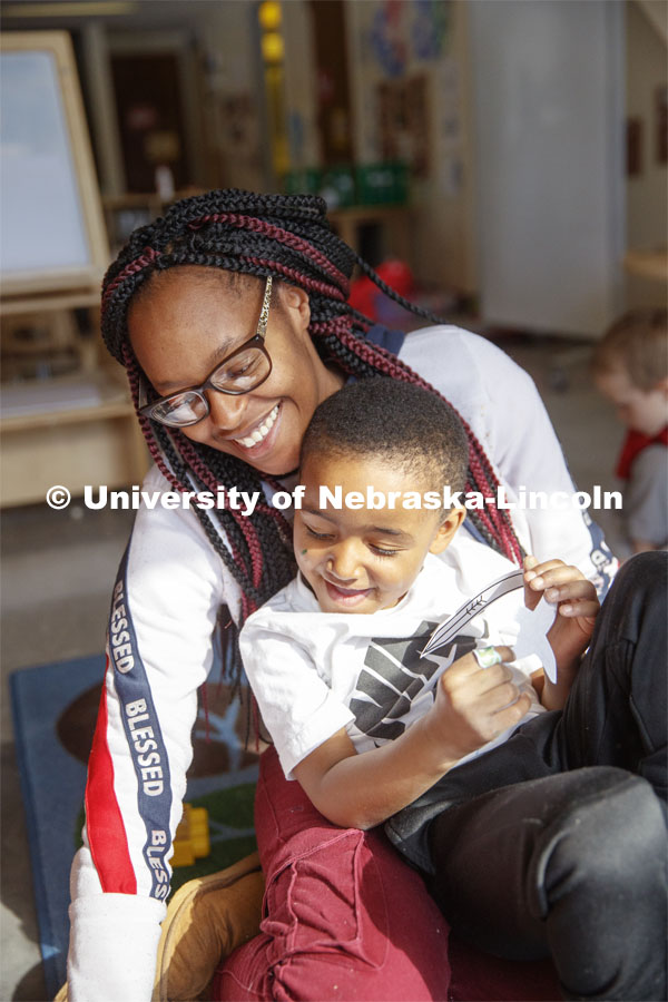 DaVon Jackson, an instructor at the Malone Center, works with a group of children Thursday morning. Ruth Staples Child Development Lab student teachers and children work with children at the Malone Center. February 28, 2019. Photo by Craig Chandler / University Communication