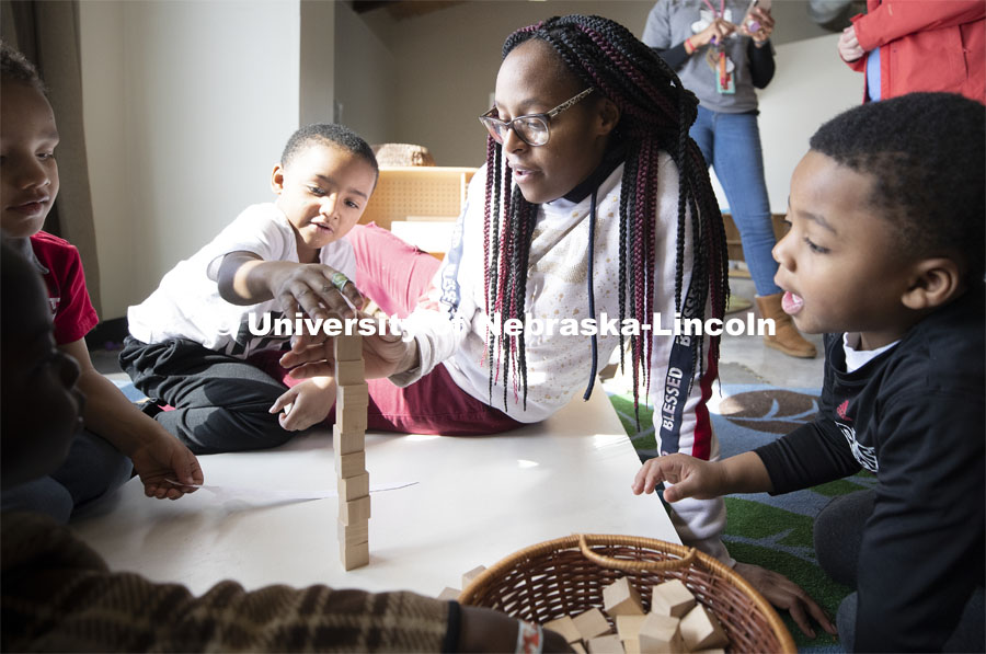 DaVon Jackson, an instructor at the Malone Center, works with a group of children Thursday morning. Ruth Staples Child Development Lab student teachers and children work with children at the Malone Center. Febrary 28, 2019. Photo by Craig Chandler / University Communication