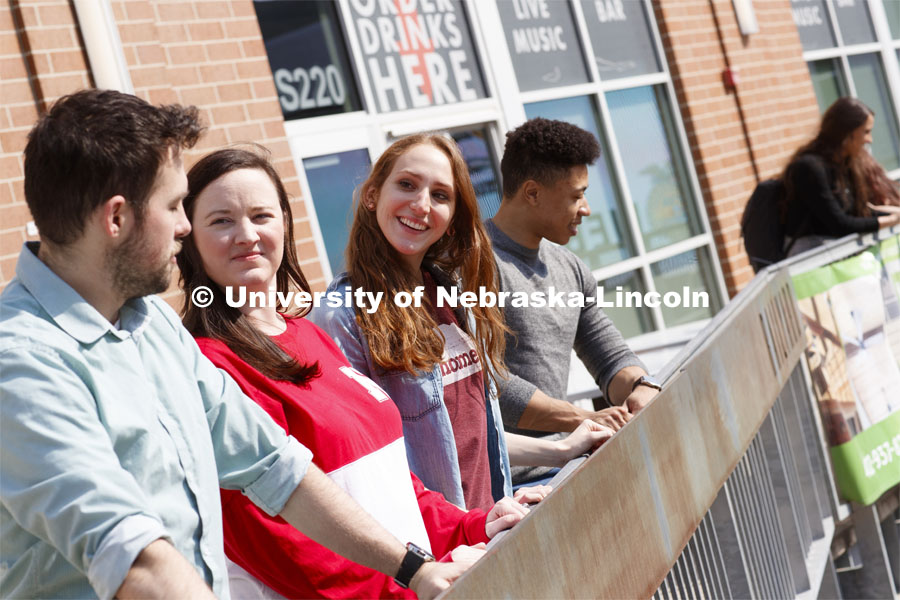 Law students hanging out in the Railyard. College of Law photo shoot in Haymarket. April 4, 2019. Photo by Craig Chandler / University Communication.