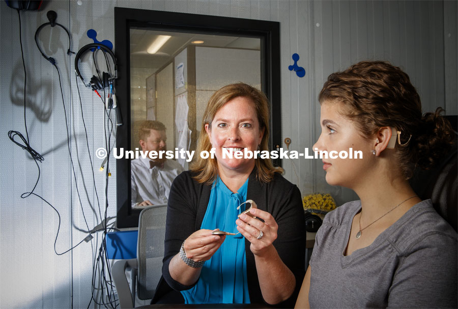 Michelle Hughes, Associate Professor in Special Education and Communication Disorders, is working to improve experiences for cochlear implant users. Pictured with her is Sophie who received her implants at an early age. Photo used for 2018-2019 Annual Report on Research at Nebraska. July 8, 2019. Photo by Craig Chandler / University Communication.