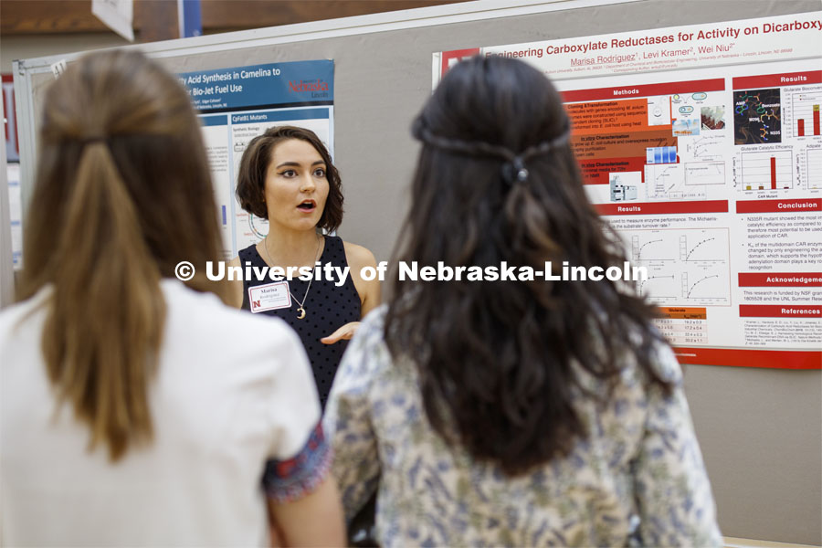 Marisa Rodriguez of Auburn University, discusses her summer research on engineering carboxylate reductases for activity on dicarboxylates. Summer Research poster session in the Nebraska Union. August 7, 2019. Photo by Craig Chandler / University Communication.