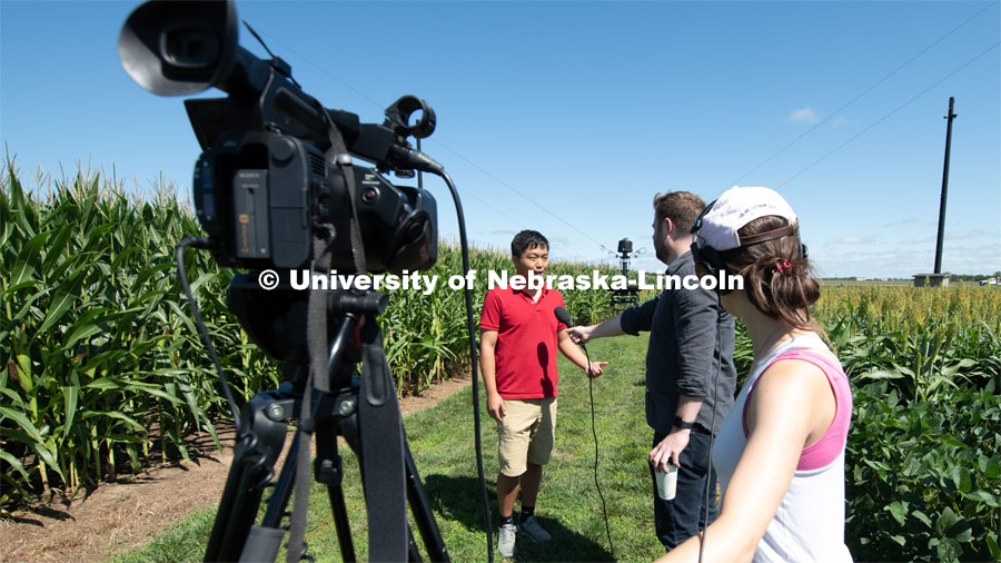 Frank Bai is interviewed by Dave Lee, Producer/Video Journalist from BBC News

San Francisco. Frank the main instrumentation person on the project, which uses a suspended camera, spidercam, to learn about characteristics of crops. Eastern Nebraska Research and Extension Center, 1071 Co Rd G, Ithaca, NE. July 14, 2019. Photo by Gregory Nathan / University Communication.

