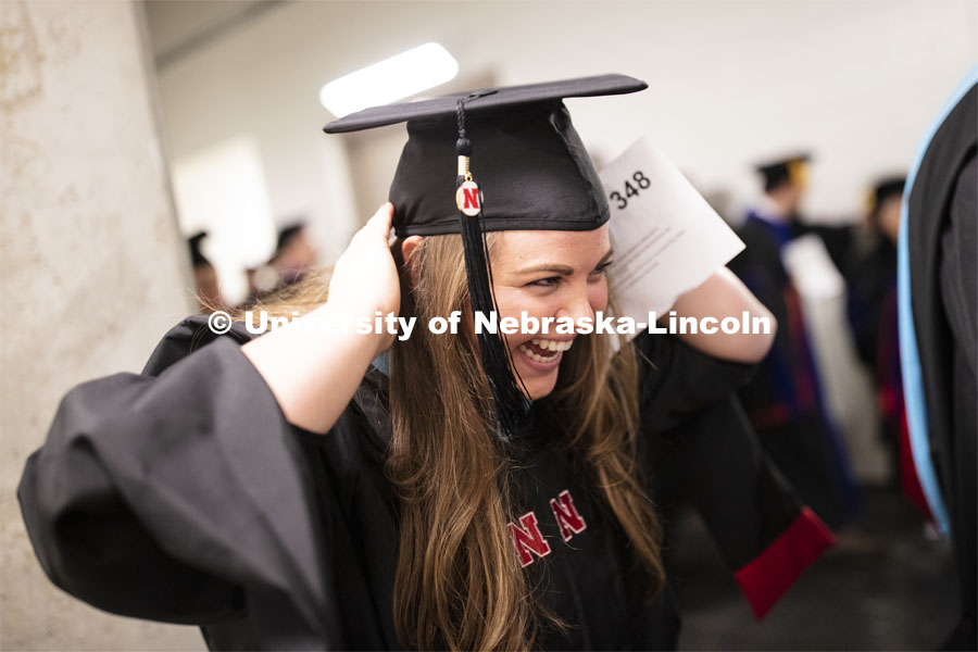 Jocelyn Whittrock adjusts her mortar board before commencement. 2019 Summer Commencement at Pinnacle Bank Arena. August 17, 2019. Photo by Craig Chandler / University Communication.
