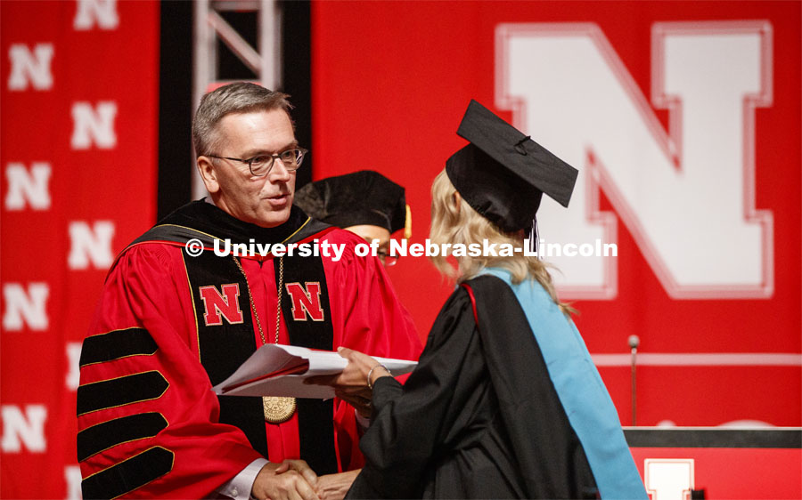 Chancellor Ronnie Green congratulated each graduate degree recipient. 2019 Summer Commencement at Pinnacle Bank Arena. August 17, 2019. Photo by Craig Chandler / University Communication.