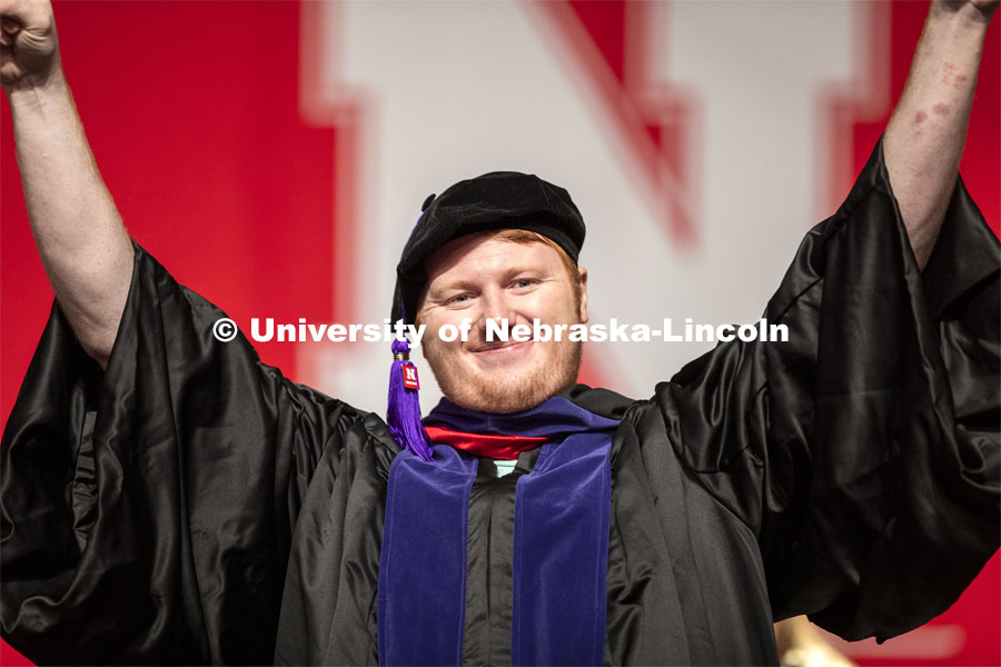 Maxwell Anderson gestures after receiving his law degree JD Saturday morning. 2019 Summer Commencement at Pinnacle Bank Arena. August 17, 2019. Photo by Craig Chandler / University Communication.