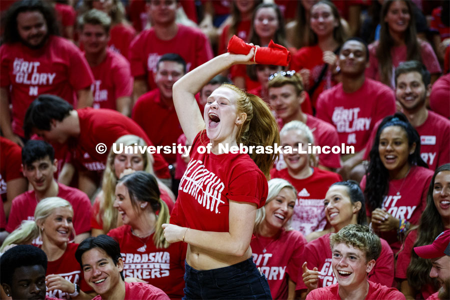 A student celebrates after catching a t-shirt thrown into the crowd by the administrators speaking at the New Student Convocation. August 23, 2019. Photo by Craig Chandler / University Communication.