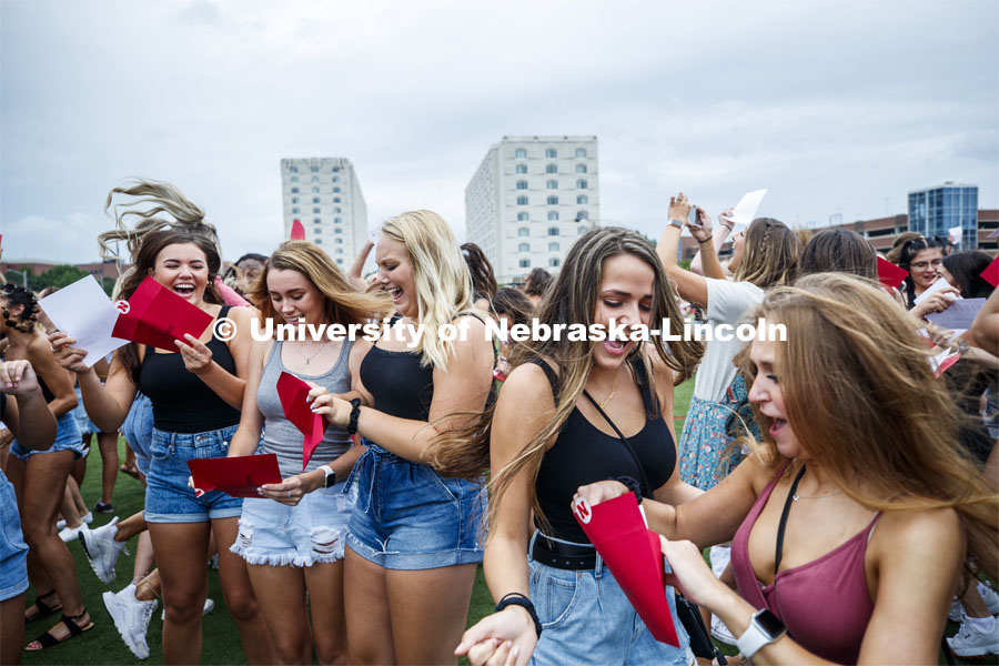 Lauryn Johnson and Allyse Kleiber celebrate after opening their bids. New sorority members celebrate their bids as they open their invitations on the intramural fields. Sorority Bid Day. August 24, 2019. Photo by Craig Chandler / University Communication.