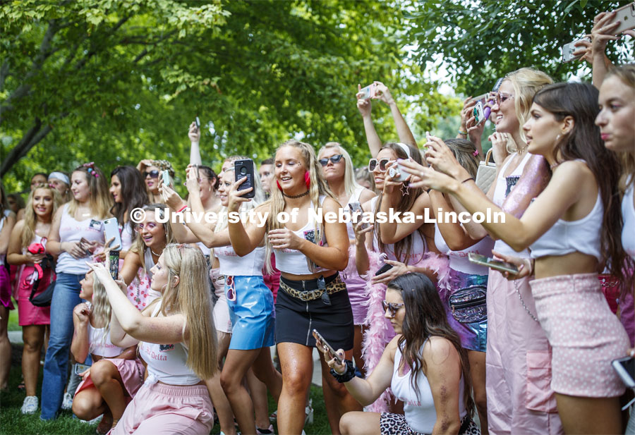 Alpha Xi Delta members photograph the group of new members. Sorority Bid Day. August 24, 2019. Photo by Craig Chandler / University Communication.