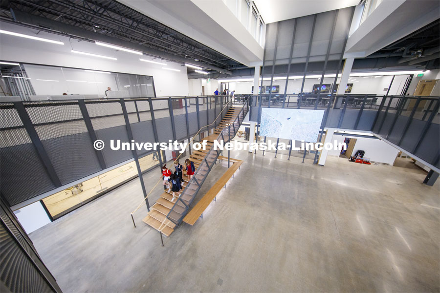 A group of students walk down the stairs in the atrium of the new Johnny Carson Center for Emerging Media Arts. The open area will be filled with moveable walls to create flexible spaces once all the furniture arrives. August 26, 2019. Photo by Craig Chandler / University Communication.