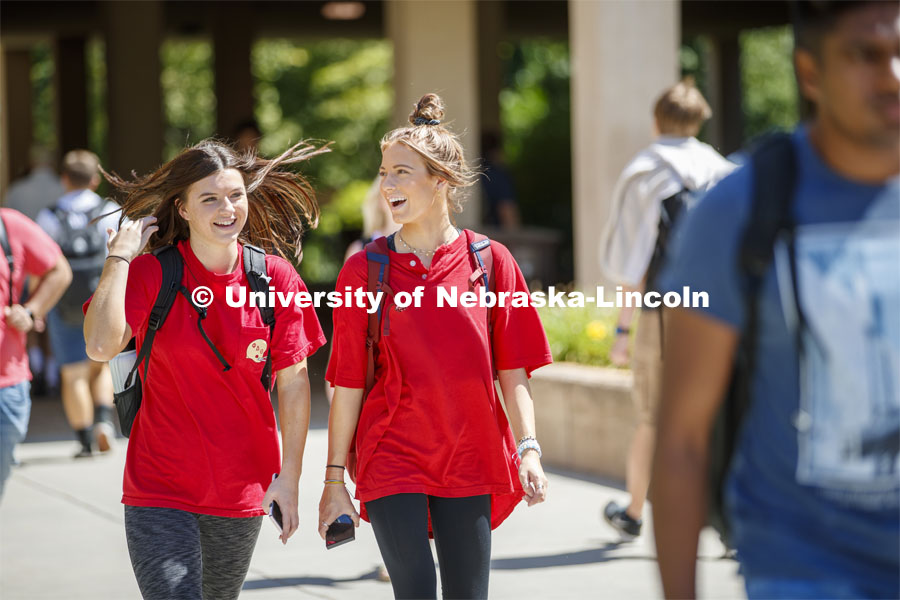 Sophomores Abbey Schiemann and McKena Roubicek talk Wednesday afternoon while heading to their chemistry lab in Hamilton Hall on City Campus. August 28, 2019. Photo by Craig Chandler / University Communication.