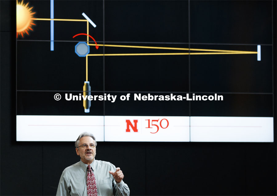 Daniel Claes, department chair and professor of Physics and Astronomy, demonstrates how light bends while going through an object. The lecture was the September N150 Nebraska Lecture. September 10, 2019. Photo by Craig Chandler / University Communication.