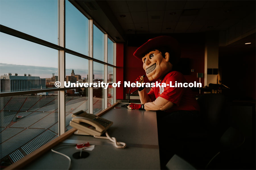 Herbie in the announcers booth. Herbie Husker photo shoot, pictured throughout Memorial Stadium. September 13, 2019. Photo by Justin Mohling / University Communication.