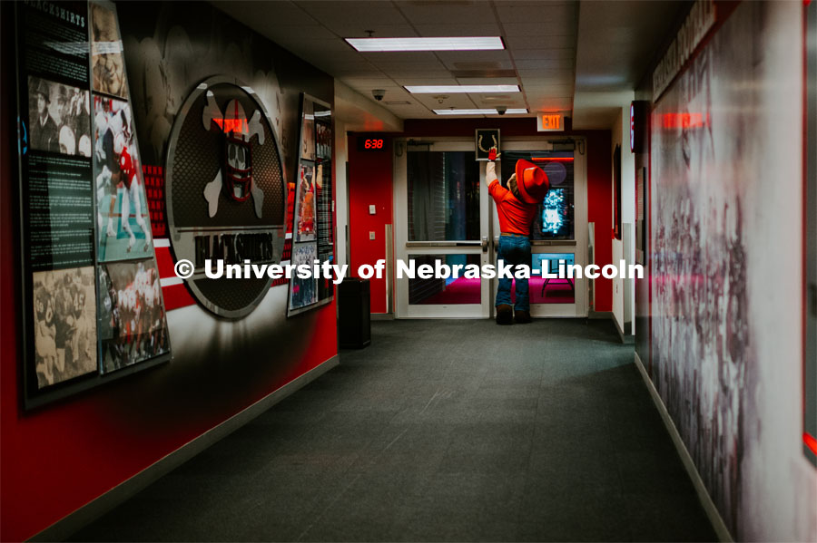 Herbie walking out the tunnel and slapping some luck. Herbie Husker photo shoot, pictured throughout Memorial Stadium. September 13, 2019. Photo by Justin Mohling / University Communication.