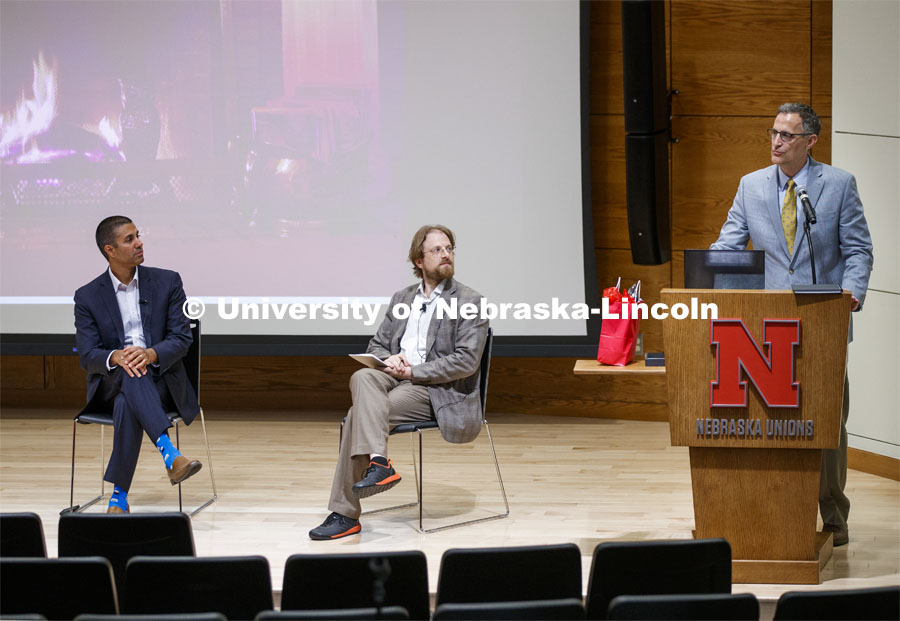 Ajit Pai, chairman of the Federal Communications Commission, and Gus Hurwitz, Co-Director, Space/Cyber/Telecomm Program and College of Law Associate Professor, listen to Richard Moberly, Interim Executive Vice Chancellor, introduce the fireside chat in the Nebraska Union auditorium. Pai visited the University of Nebraska–Lincoln on Sept. 18. The visit is hosted by the University of Nebraska College of Law’s Space, Cyber and Telecommunications Law program and its co-director Gus Hurwitz. September 18, 2019. Photo by Craig Chandler / University Communication.