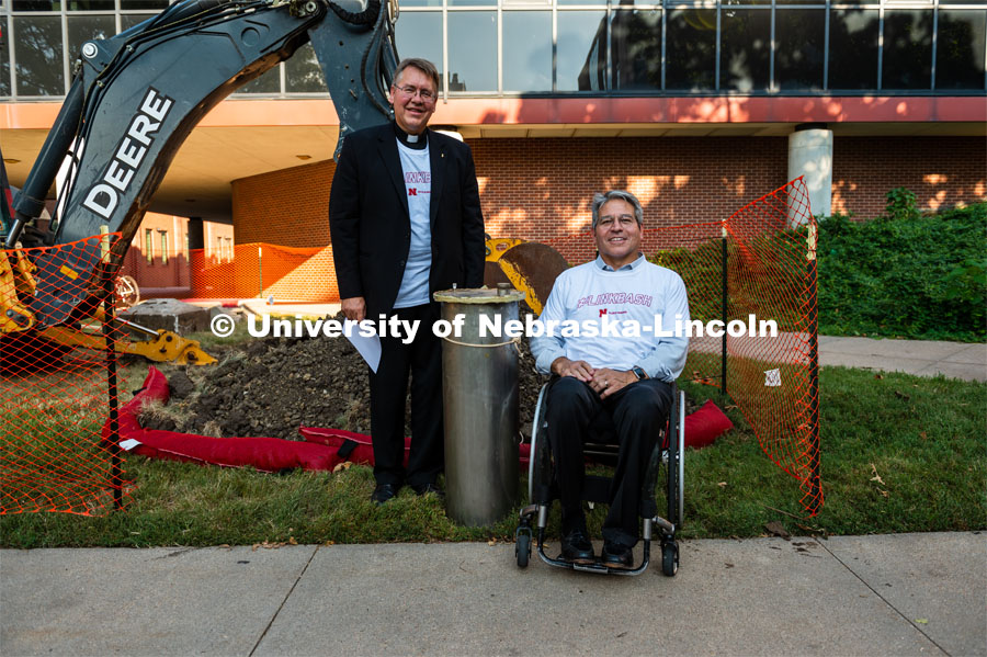 Pictured; Bill Holoubek and Lance Perez, Dean of Engineerng. Bill Holoubek, a 1987 agricultural engineering graduate and now a Catholic priest, oversaw the project to build the time capsule, and came back to be a part of the unearthing of the capsule. The College of Engineering expansion projects have temporarily unearthed a time capsule buried in 1987, 32 years ago. The capsule was buried near the entrance to the Scott Engineering Center. September 19, 2019. Photo by Justin Mohling / University Communication.