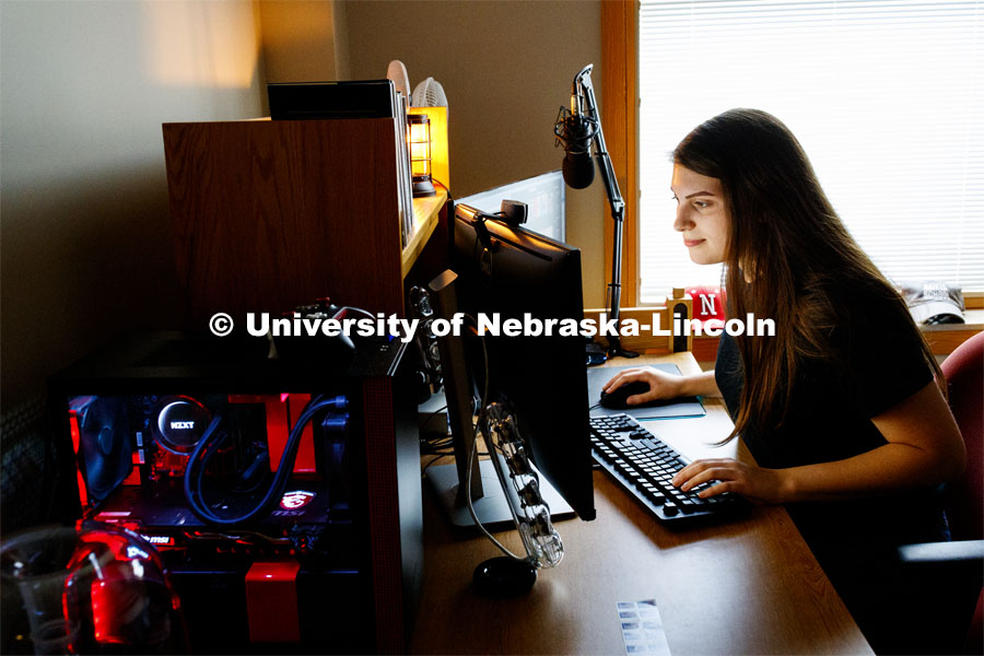 Young woman studying on her computer in her Kauffman Academic Residential Center dorm room. Raikes school photo shoot. September 25, 2019. Photo by Craig Chandler / University Communication.