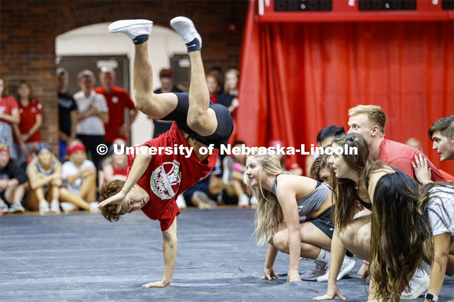 Nhan Nguyen of Lambda Phi Epsilon does a handstand to finish out the first place winners Triad 8--Sigma Chi, Chi Omega, Alpha Chi Omega, Alpha Gamma Sigma, Lambda Phi Epsilon—performs. Showtime at the Coliseum performances as part of Homecoming week. September 30, 2019. Photo by Craig Chandler / University Communication.