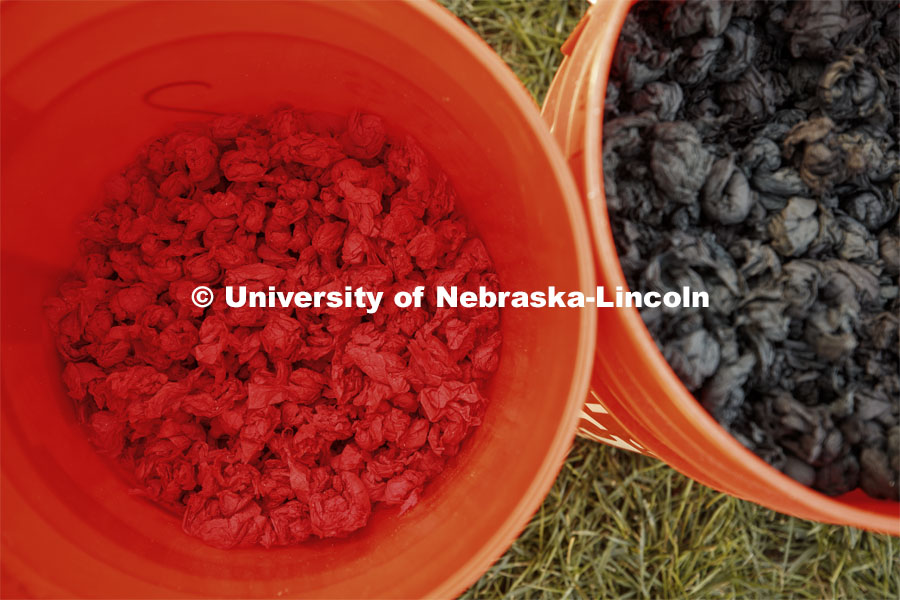 Buckets of red and black pom poms for the 2019 Homecoming display decorations. October 3, 2019. Photo by Craig Chandler / University Communication.