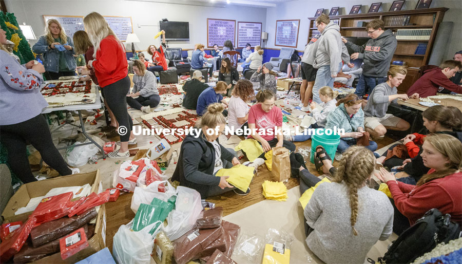 The floor of Phi Delta Theta fraternity is filled with students pomping. 2019 Homecoming display decorations. October 3, 2019. Photo by Craig Chandler / University Communication.