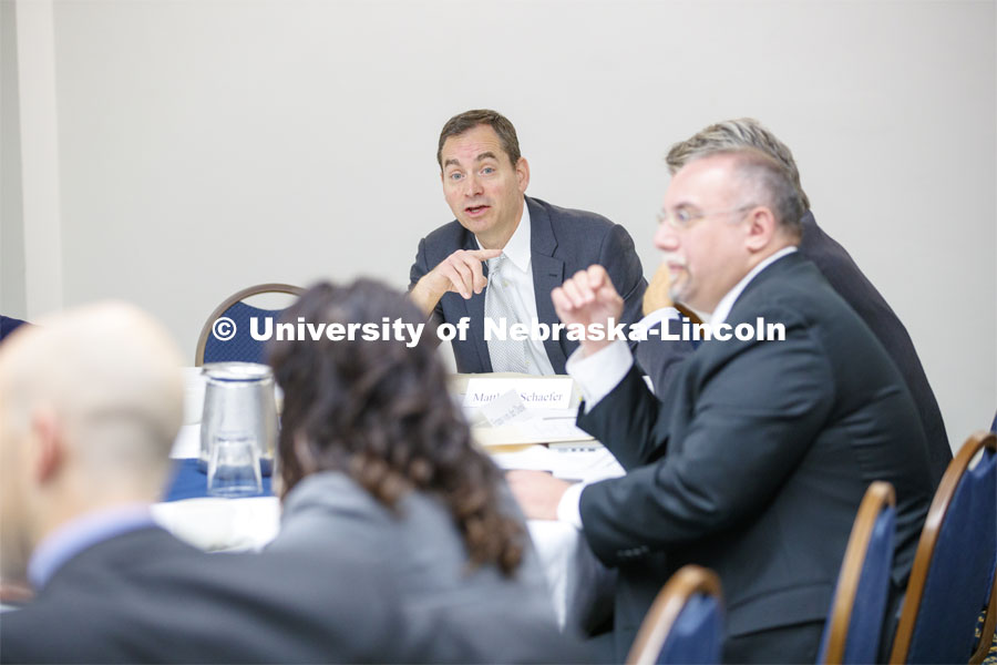 Matthew Schaefer, dark hair, and Frans von Der Dunk, both Nebraska Law professors, lead a discussion before the conference. Global Perspectives on Space Law and Policy conference in Washington D.C.  October 18, 2019. 12th Annual University of Nebraska D.C. Space Law Conference. Space, Cyber and Telecommunications Law program. Photo by Craig Chandler / University Communication.