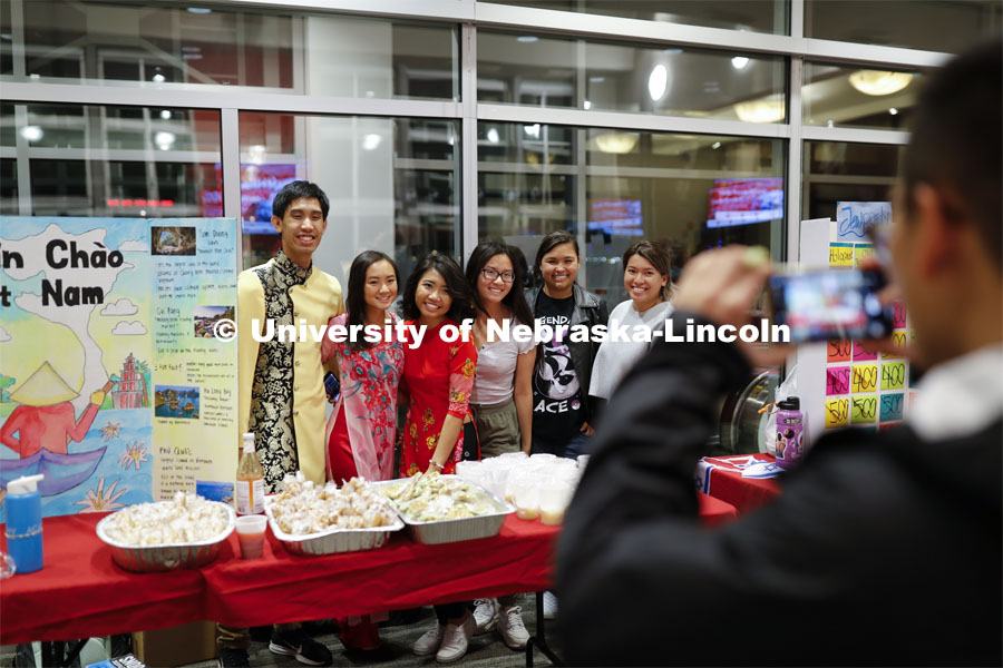 Vietnamese Student Association students pose for a photo at their booth. Global Huskers Festival, a multicultural festival provides attendees the chance to explore the world through informational booths that will have food, cultural décor, art, and more, each hosted by UNL students from those culture. November 19, 2019. Photo by Craig Chandler / University Communication.