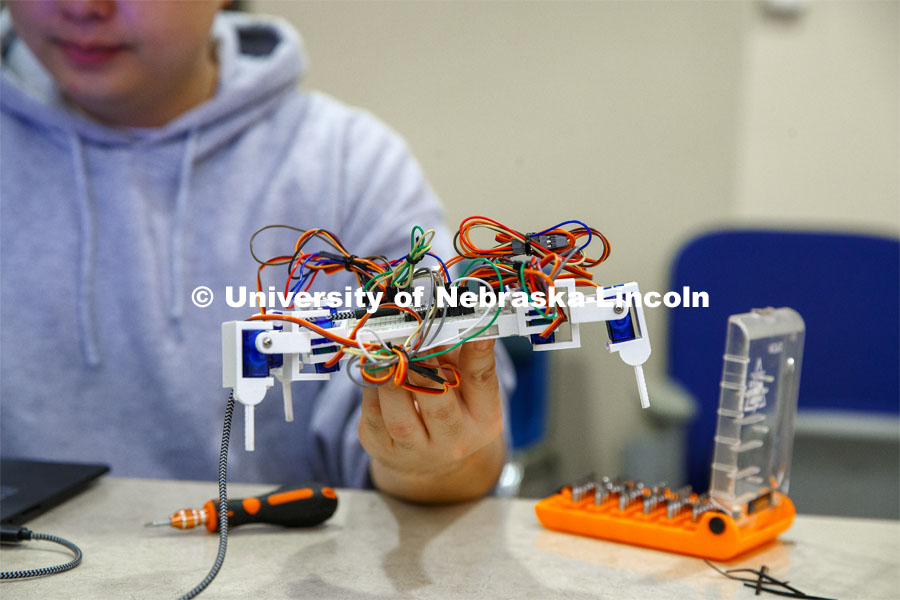 Students in Mark Bauer ECEN 102 - Introduction to Electrical Engineering class work on small robots they build and program to deliver a plastic cube along a specific path. November 20, 2019. Photo by Craig Chandler / University Communication.