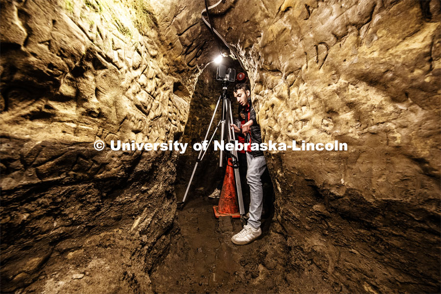Dylan Downes, a sophomore in civil engineering from Lincoln, sets up the LIDAR in the well area of the cave. Professor Ricky Wood uses LIDAR to digitally map Robbers Cave in Lincoln. November 22, 2019. Photo by Craig Chandler / University Communication.