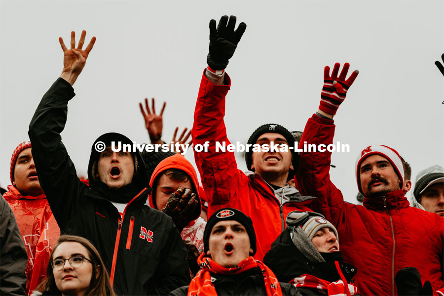 Students hold up four fingers signaling fourth quarter. Nebraska vs. Iowa State University football game. November 29, 2019. Photo by Justin Mohling / University Communication.