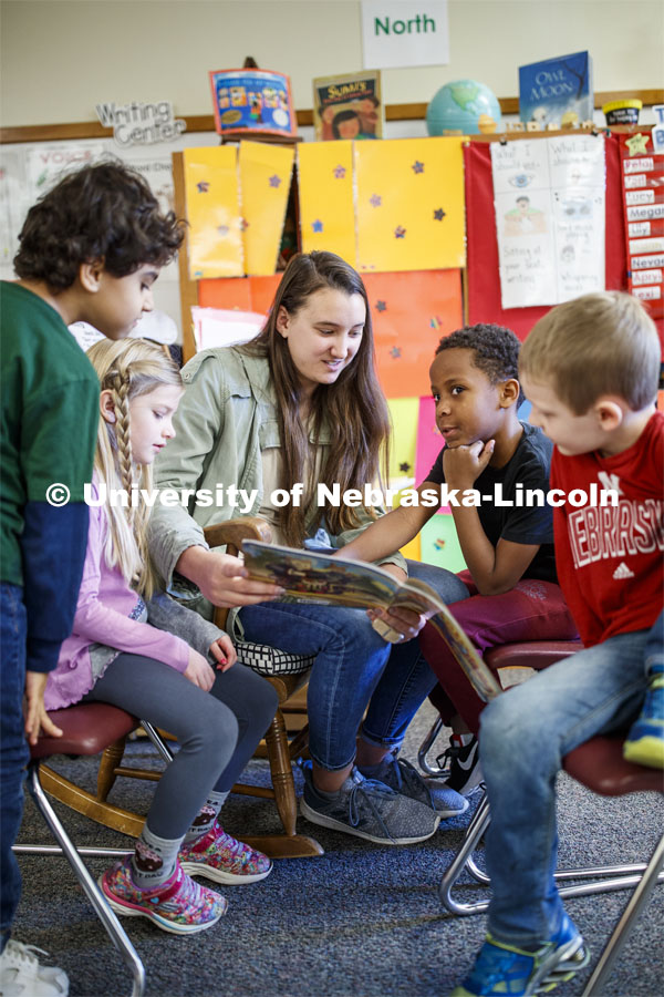 Megan Groth, sophomore in Speech-Language Pathologist, reads to first graders at Saratoga Elementary school as part of the America Reads / America Counts project. December 5, 2019. Photo by Craig Chandler / University Communication.