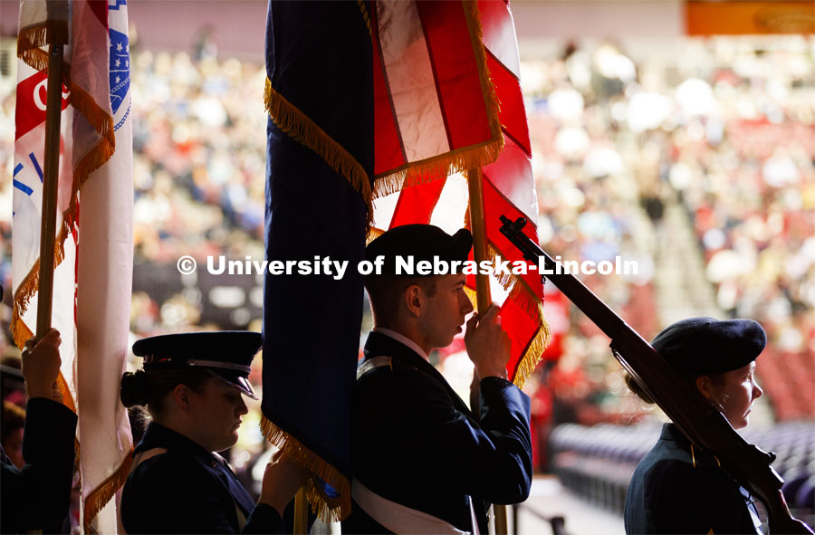 The ROTC march in carrying the flag. December Undergraduate commencement at Pinnacle Bank Arena. December 21, 2019. Photo by Craig Chandler / University Communication.