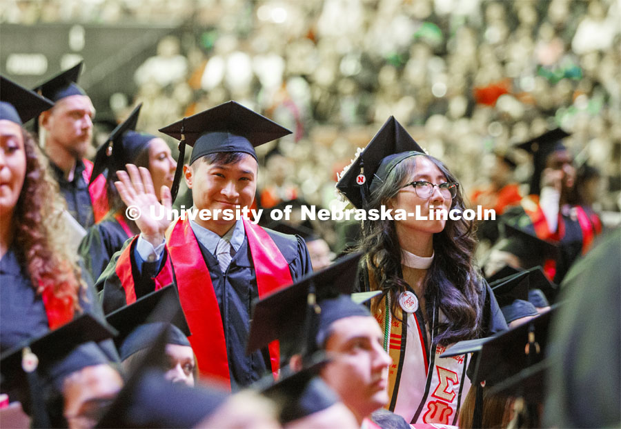 David Nguyen waves to his family. December Undergraduate commencement at Pinnacle Bank Arena. December 21, 2019. Photo by Craig Chandler / University Communication.