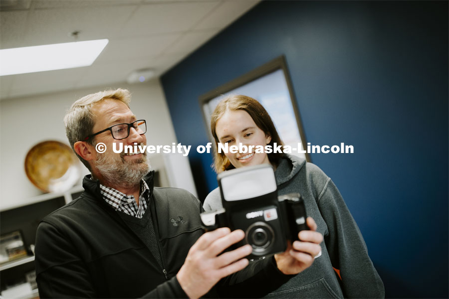 Grace Gawecki approves her photo taken by Scott Hurst at Passport Services. She was a winner in the Husker Passport Giveaway sponsored by Education Abroad. January 30, 2020. Photo by Craig Chandler / University Communication.