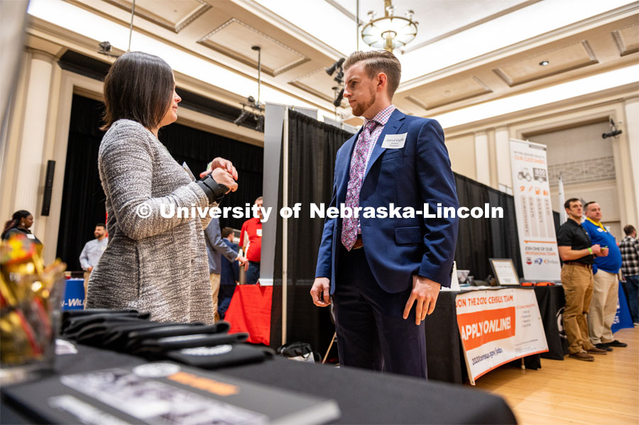 UNL student Jared Gafke talks to a potential employer. Employers are able to talk with students about possible employment at the Spring University Career Fair in the Nebraska Union. February 11, 2020. Photo by Justin Mohling / University Communication.