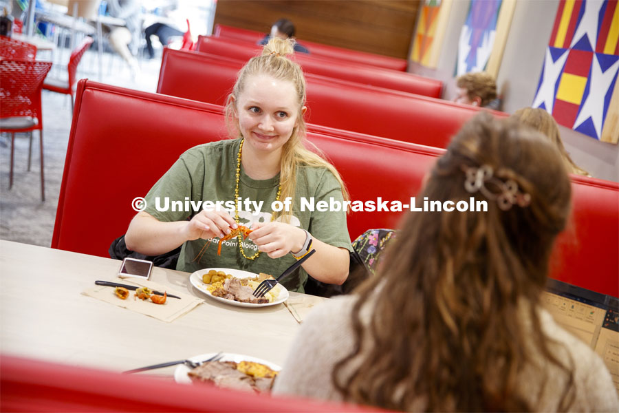 Sydney Wells, senior from Broken Bow, eats her crawfish at the Mardi Gras special meal at East Campus Dining Center. February 25, 2020. Photo by Craig Chandler / University Communication.