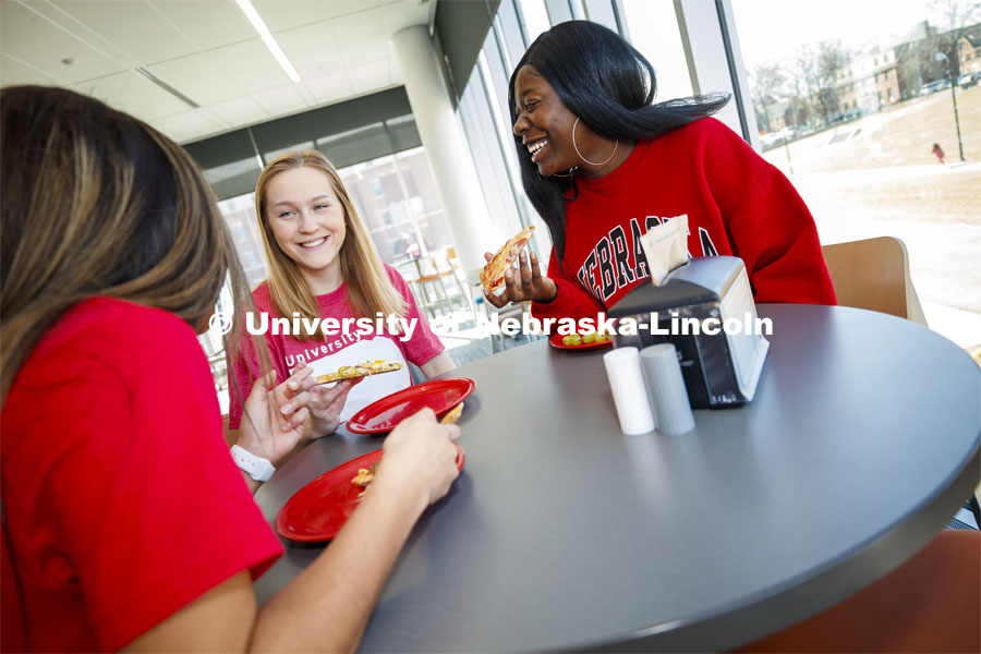 Cather Dining Center photoshoot. Young women eating together in the Cather Dining Center. March 2, 2020 Photo by Craig Chandler / University Communication.