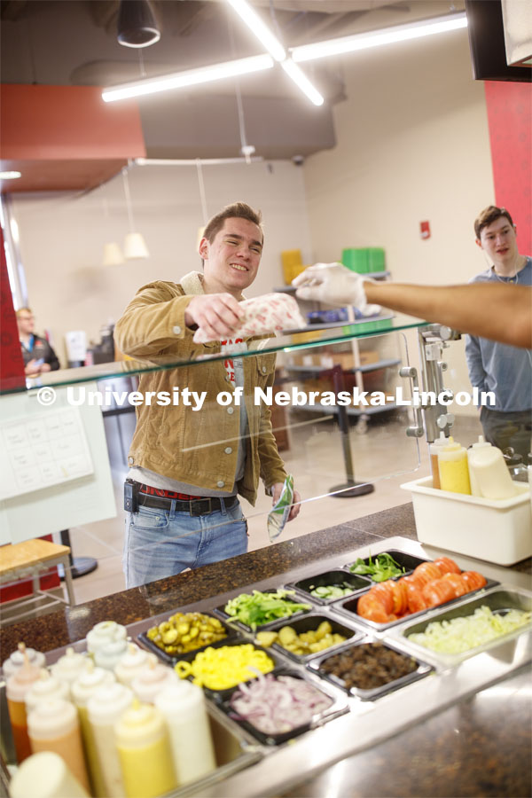 Abel Sandoz Dining Center photo shoot. Student's pick up their order at Husker Heroes. March 3, 2020. Photo by Craig Chandler / University Communication.