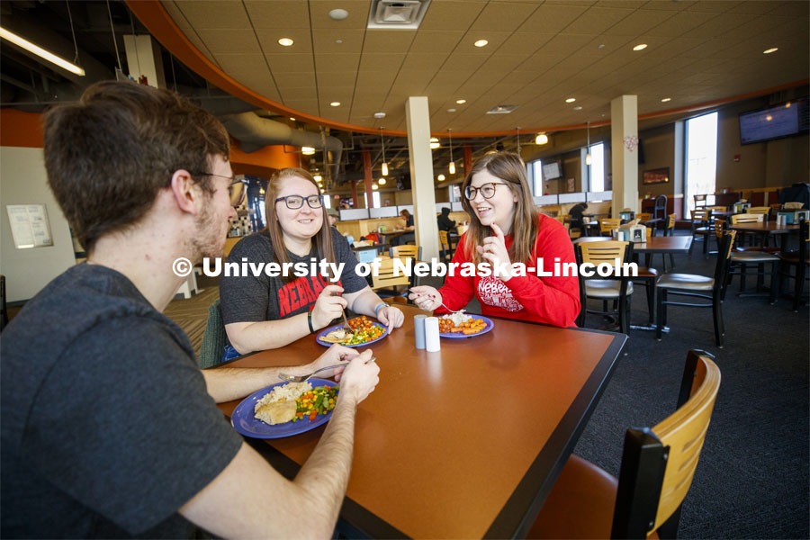 Harper Dining Center photo shoot. Students visit while enjoying their meal at Harper Dining Center. March 3, 2020. Photo by Craig Chandler / University Communication.