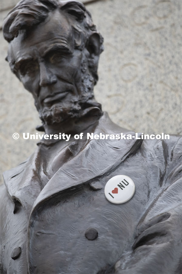 NU Advocacy Day at the Capitol. Statue of Abe Lincoln outside the Capitol decked out with an “I Love NU” button. The button was "attached" using Photoshop, not physically attached. March 10, 2020. Photo by Craig Chandler / University Communication.