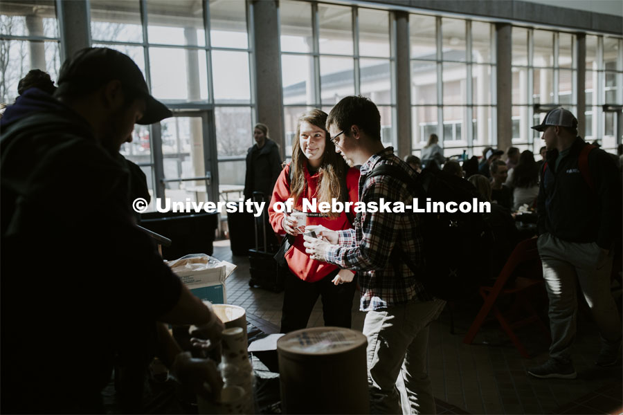 Miranda Mueller smiles after getting a root beer float as part of Lunch In The Lobby in the Animal Science building lobby, a part of CASNR week. March 11, 2020. Photo by Craig Chandler / University Communication.