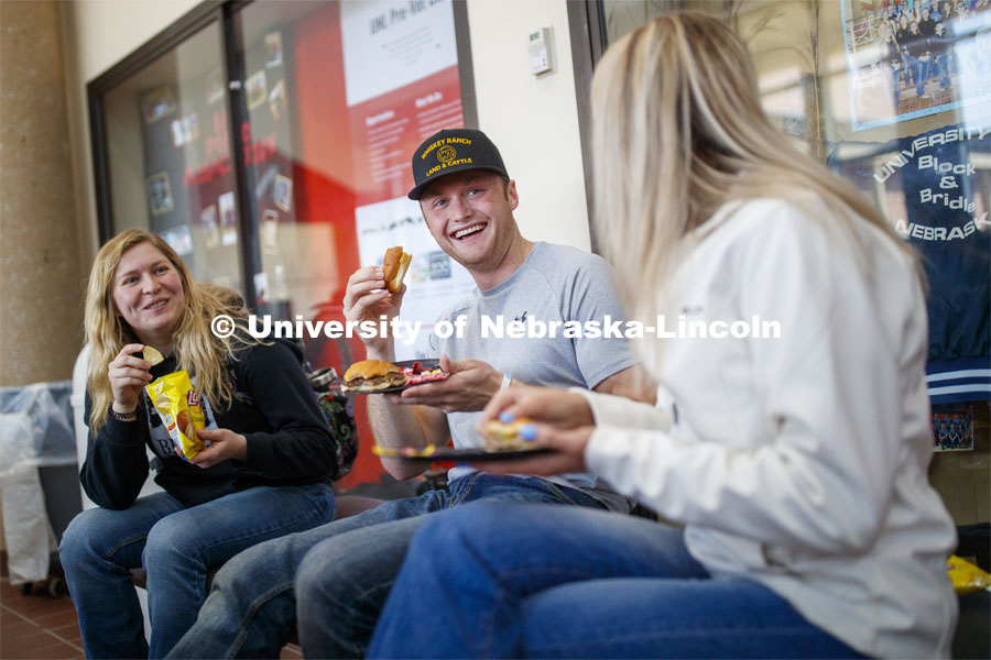 Sloane Tiarks, Chad Bode and Rachel Stewart enjoy lunch Wednesday. Lunch In The Lobby in the Animal Science building lobby is part of CASNR week. March 11, 2020. Photo by Craig Chandler / University Communication.
