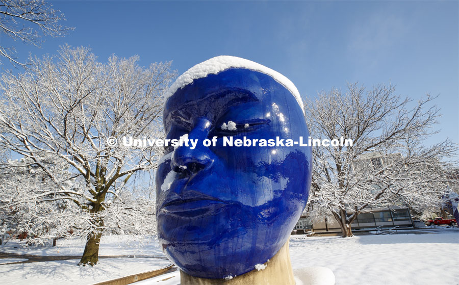 The “Untitled” head by Jun Kaneko in the Sheldon Sculpture Garden, is covered in a layer of snow. An April snowstorm leaves campus unseasonably beautiful. April 17, 2020. Photo by Craig Chandler / University Communication.