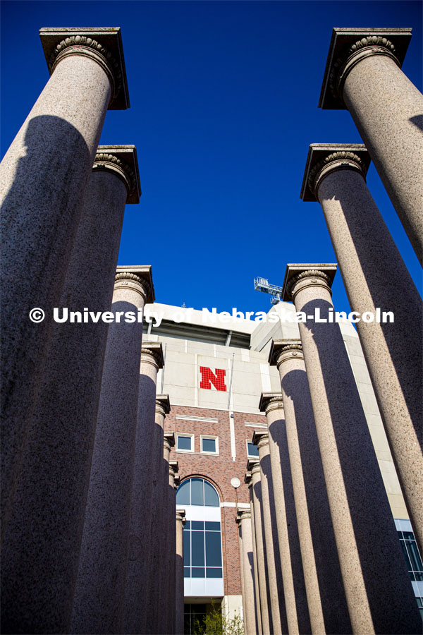 Looking through the columns and the east side of Memorial Stadium. City Campus. April 25, 2020. Photo by Craig Chandler / University Communication.