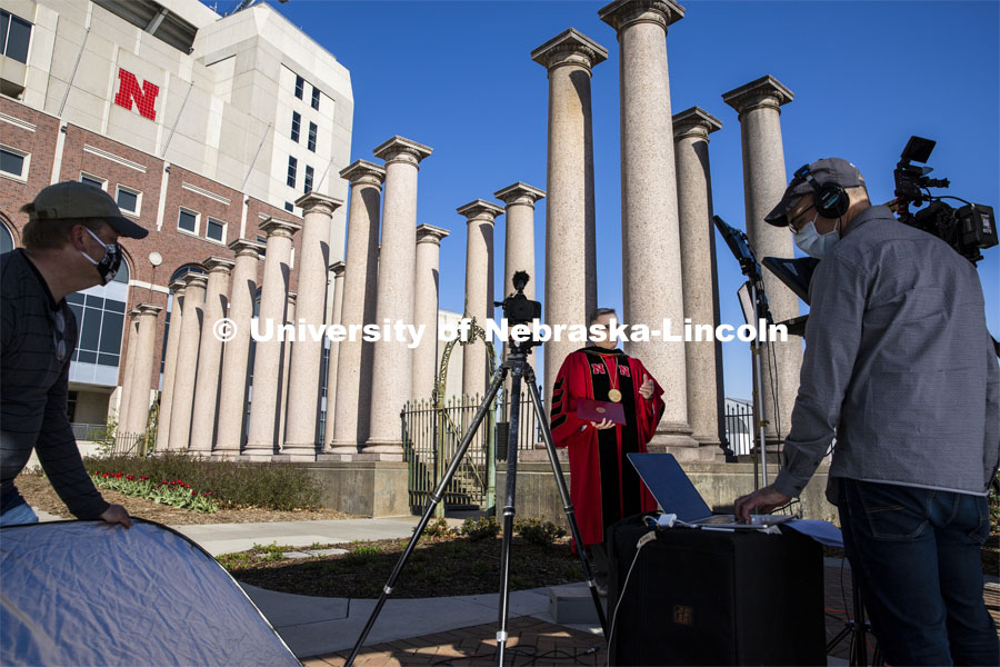 UCOMM’s video team, Curt Bright and Dave Fitzgibbon video Chancellor Ronnie Green as he delivers his virtual commencement remarks in front of the columns at the production of the commencement show. April 25, 2020. Photo by Craig Chandler / University Communication.