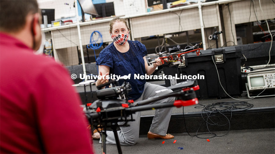 Brittany Duncan, assistant professor of Computer Science and Engineering, discusses drone equipment in the Nimbus Lab. Brittany is wearing a mask for protection from the COVID-19 pandemic. June 23, 2020. Photo by Craig Chandler / University Communication.