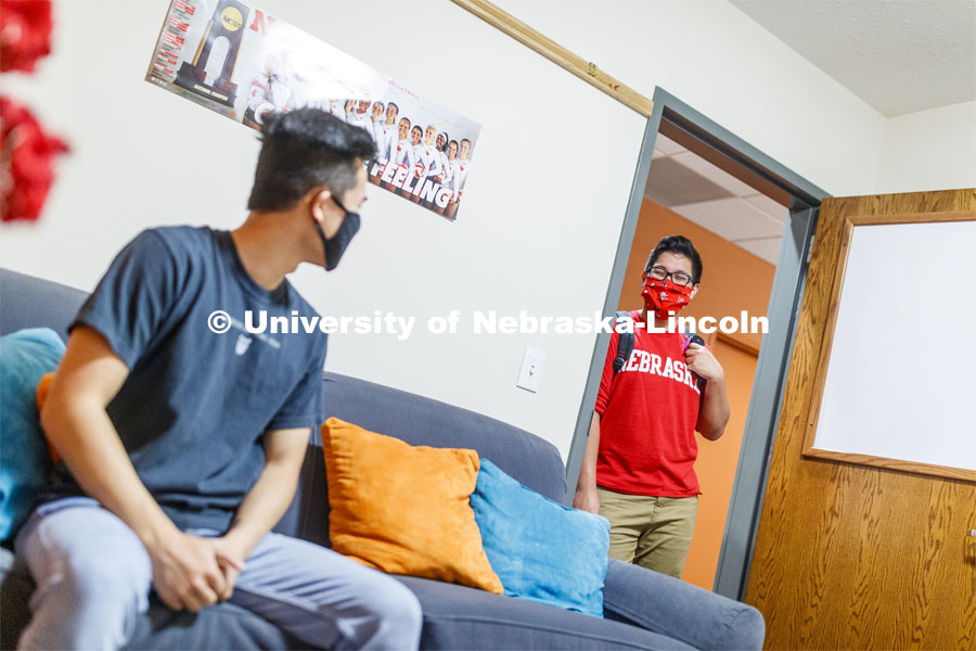 PJ Miguelino talks in a University Suites Residence Hall room. Photo shoot of students wearing masks and practicing social distancing. June 24, 2020. Photo by Craig Chandler / University Communication.